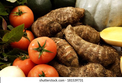 A Collection Of Vegetables With A Traditional African Tuber Potato Called A Madumbi In The Center