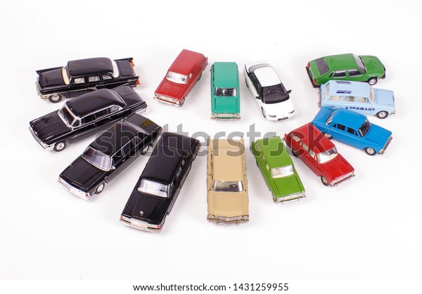 Collection of vintage metal die-cast car\
models isolated on the white\
background
