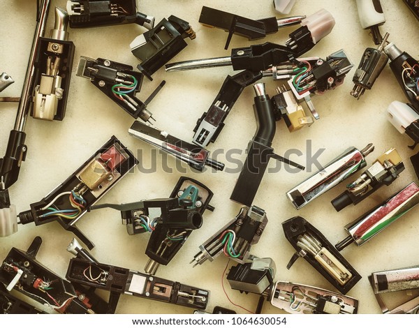 Collection of vintage record player stylus\
cartridges on a flee\
market