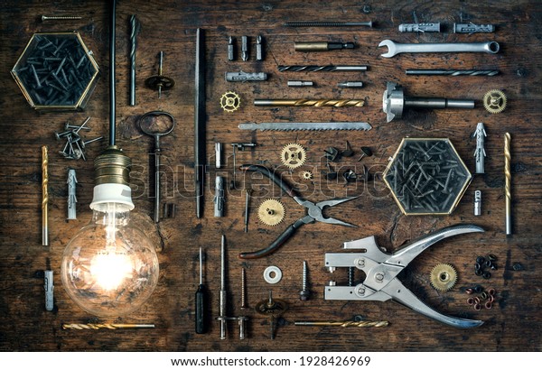 Collection of vintage\
tools, nstrument, device displayed on a wood background. Steampunk\
sttyle retro background. Industrial old background from old tools\
and appliances.\
\
