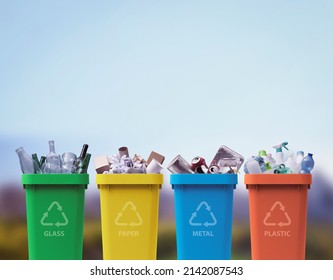 Collection of waste bins full of different types of garbage, recycling and separate waste collection concept - Shutterstock ID 2142087543