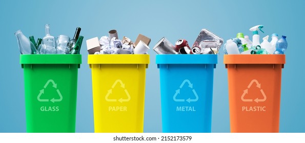 Collection of waste bins full of different types of garbage, recycling and separate waste collection concept - Shutterstock ID 2152173579