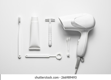 Collection of white objects isolated on white desktop, view from the top