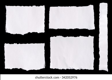 Collection Of White Ripped Pieces Of Paper On Black Background