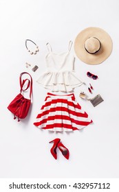 Collection Of Women's Clothing And Accessories. Overhead Of Essentials Young Woman. Outfit Of Casual And Elegant Woman, Red Shoes, Summer Hat, Handbag, High Heels Shoes, Sunglasses.