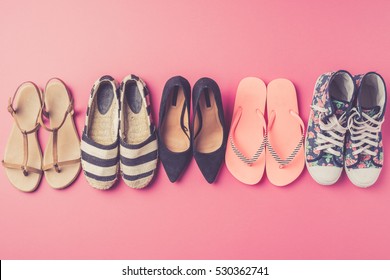 Collection Of Women's Shoes On Pink Background