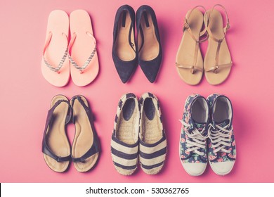 Collection Of Women's Shoes On Pink Background