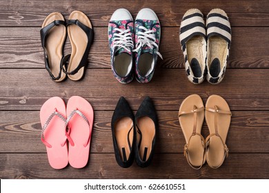 Collection Of Women's Shoes On Wooden Background