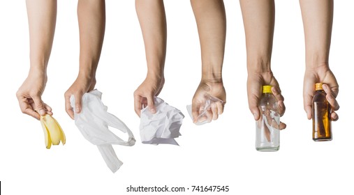 Collections of hand holding banana peel, white plastic bag, crumpled paper, plastic glass and bottles isolated on white background. Management waste sorting concept