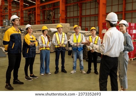 Collective factory worker and engineer gather for meeting with factory executive or manager, discussing plan and industry training program on-site work heavy industrial steel workshop. Exemplifying