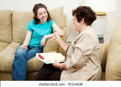 College Admissions Counselor Or Therapist Interviews Teen Student.  It's Going Well.