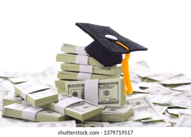 College Admissions Scandal: Mortarboard On A Pile Of Money Representing The High Cost Of Education, Student Loans And Bribery. Bills Are Stage Money.