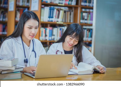 College Age Nursing Or Medical Students Talking In Class Searching ForsubjectIn The Library