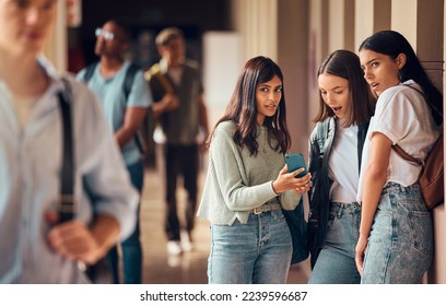 College friends, phone and gossip or fake news about students on social media, internet and mobile app with teenager group talking. Smartphone bullying post of male and female people at university - Powered by Shutterstock