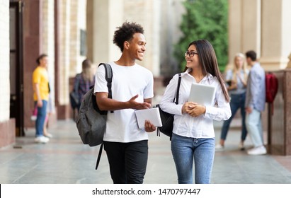 College friends walking in campus and talking, having break after classes - Shutterstock ID 1470797447