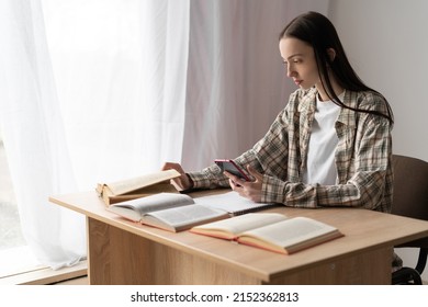 College Girl Student Studying Remotely Using Modern Smartphone, Distance Education Lesson Online At Home, Technology For E-learning, Profile View, Education Concept