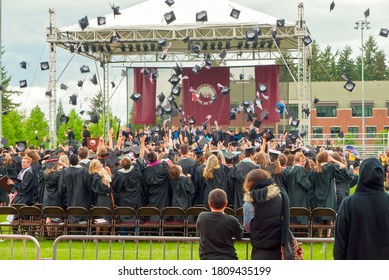 College Graduates Tossing Caps At Graduation, Tacoma, WA USA May 19, 2013