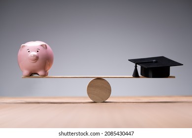 College Graduation Hat On Piggy Bank With Money