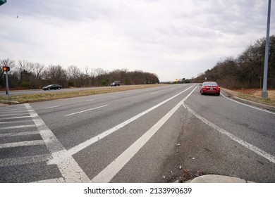 College Park, Maryland - USA - March 03, 2022: Red Car On A Highway (Prince George County).