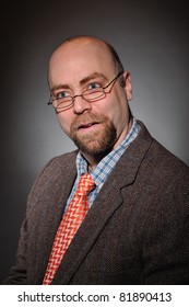 College Professor With A Tweed Coat And An Orange Tie Over A Gray Background