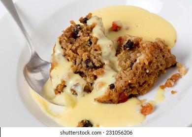College pudding, the traditional steamed dessert served to students at Oxford and Cambridge, containing dried fruits, candied peel, flour, sugar, bread, egg and suet served with custard.