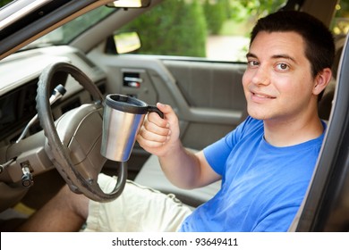 College Student In The Car With Travel Coffee Mug