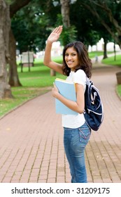 College Student Saying Good Bye And Waving To Her Friend