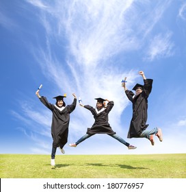 College Students Celebrate Graduation And Happy Jump