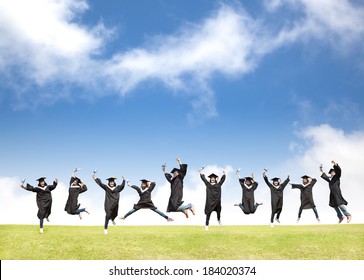 College Students Celebrate Graduation And Happy Jump