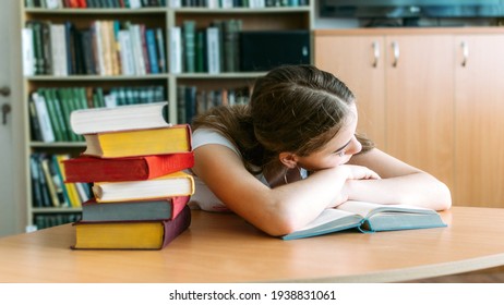 College Students overwhelmed, overworked, burned out, perfectionists. Teen tired girl, young woman sitting at table with books in college library
