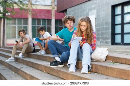 College Students Prepare Together During Recess Outside