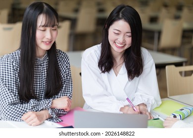 College Students Studying In The Cafeteria