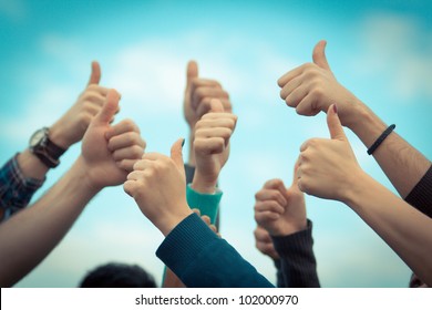 College Students with Thumbs Up - Shutterstock ID 102000970