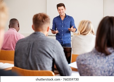 College Tutor With Digital Tablet Teaches Mature Students - Shutterstock ID 760359730