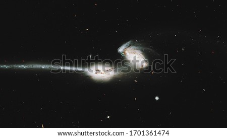Colliding galaxies,  Mice Galaxies, spiral galaxies in constellation Coma Berenices. Elements of this image furnished by NASA. Retouched image. 