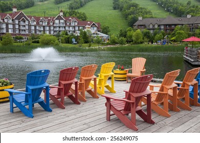 COLLINGWOOD, ON, CANADA - JUNE 18: Colorful deck chairs on Mill pond dock in summer at Blue Mountain Village, 2014