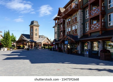 COLLINGWOOD, ON, CANADA - September 30, 2019: Shops and restaurants on pedestrian street at Blue Mountain Village in Autumn.