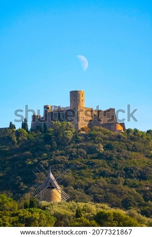 Collioure, coastal village in the south of France, Mediterranean sea, Languedoc Roussillon, Pyrenees Orientales. Big moon above Fort Saint-Elme. Moulin de la Cortina.
