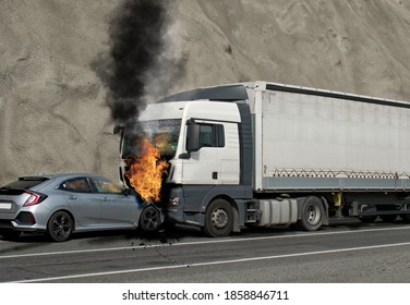 Collision Between A Car And A Truck Transporting Goods. Accident Followed By Fire. The Car Caught Fire After The Frontal Impact.