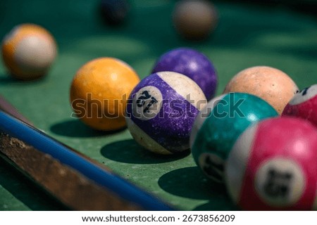 The collision on the billiard table damaged the billiard balls