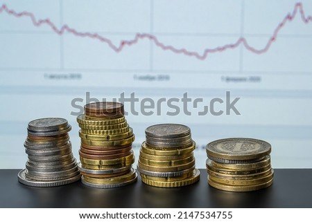Collumns of coins on background of  financical diagram. Financical and banking concept