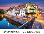 Colmar, France. Petite Venice, charming district with water canal and traditional half timbered houses. Alsace romantic city travel background.