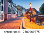 Colmar, France. Petite Venice, charming water canal and traditional half timbered houses in Alsace. French romantic city travel.