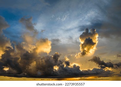 Colofrul clouds brightly illuninated by setting sun on evening sky. Changing cloudscape weather at sunset