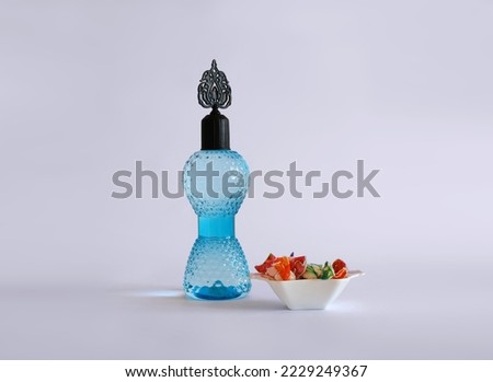 Cologne bottle and candy isolated. Happy Ramadan, happy kurban.(Turkish translate: Bayraminiz kutlu olsun. Kolonya şişesi ve şeker. Ramazan bayrami ve kurban bayrami.)