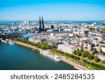 Cologne Cathedral and Hohenzollern Bridge through Rhine river aerial panoramic view in Cologne, Germany