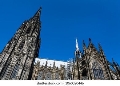 Cologne Cathedral low angle view from the side with blue sky