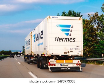 Cologne, Germany - Aug 29, 2019: Rear View Of Large Hermes White Truck Transporting Parcels On German Autobahn