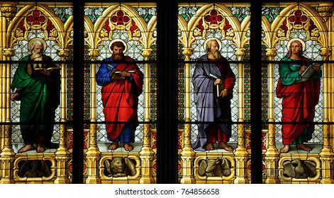 COLOGNE, GERMANY - JUNE 12, 2012 : Stained glass window depicting the Four Evangelists, Saint Matthew, Saint Mark, Saint Luke and Saint John, in Cologne Cathedral