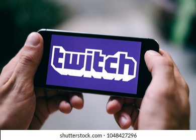 COLOGNE, GERMANY - MARCH 18, 2018: Closeup of iPhone Screen with TWITCH Gaming APP LOGO or ICON